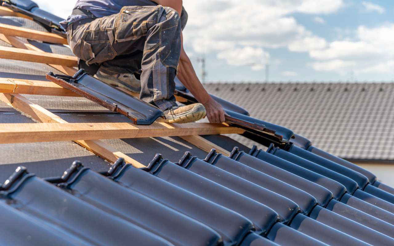 Professional roofers installing a new roof.
